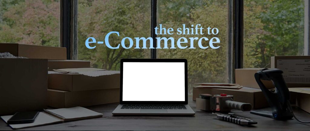 shift of ecommerce, computer next to moving boxes